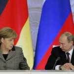 Russian President Putin and German Chancellor Merkel answer journalists’ questions during a joint news conference in Moscow’s Kremlin