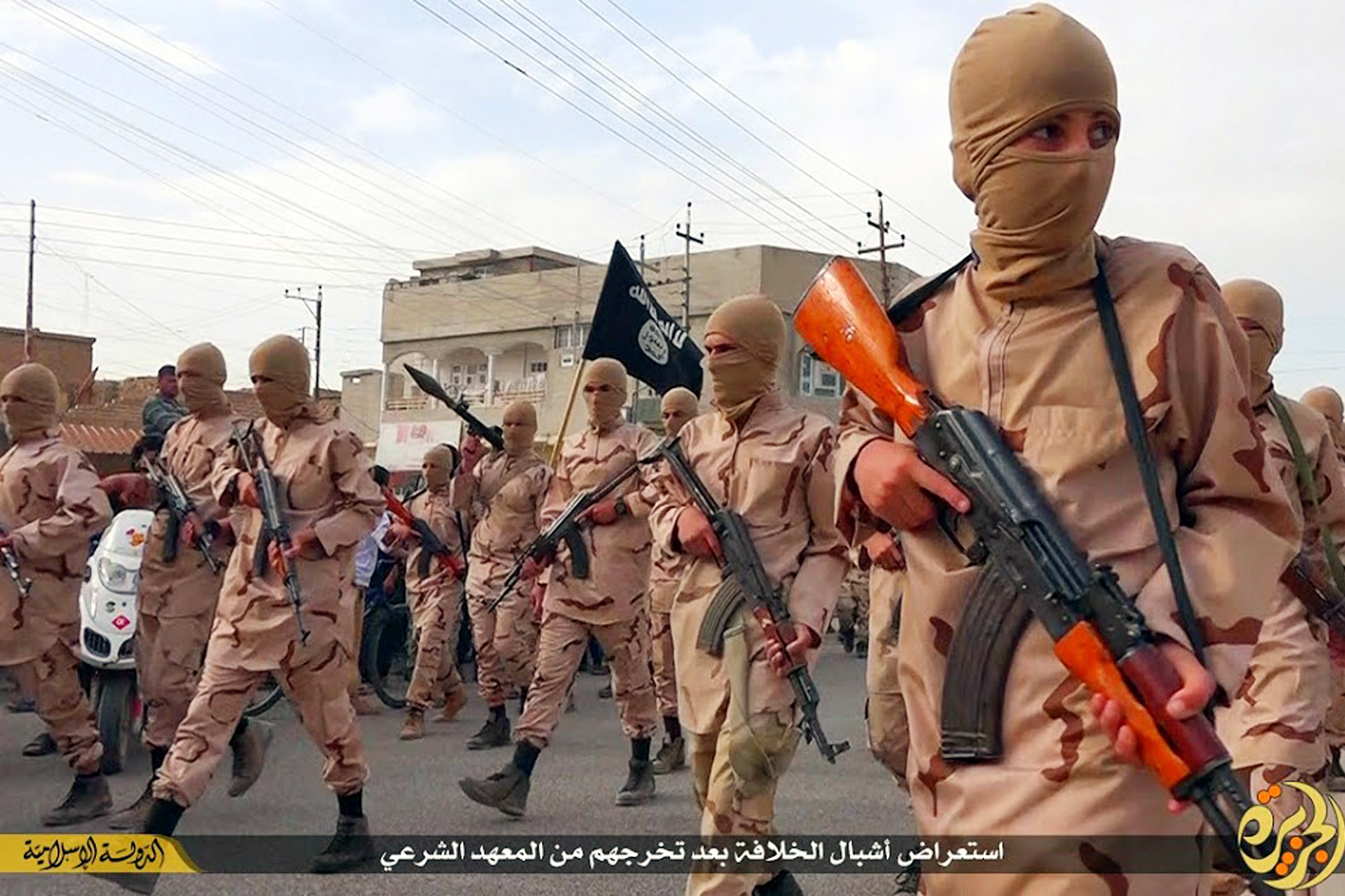 ADVANCE FOR USE SUNDAY, JULY 19, 2014 AT 1 P.M. EDT (17:00 GMT) AND THEREAFTER - In this photo released on April 25, 2015 by a militant website, which has been verified and is consistent with other AP reporting, young boys known as the "caliphate cubs" hold rifles during a parade after graduating from a religious school in Tal Afar, near Mosul, northern Iraq. The Syrian Observatory for Human Rights, a Britain-based outfit that follows the Syrian war, said it documented at least 1,100 Syrian children under 16 who joined IS so far this year, many of whom were then sent to fight in Syria and Iraq. (Militant website via AP)